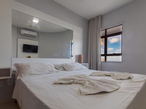 En eller flere senge i et værelse på Elegance flat Natal RN - PLAC