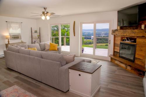 a living room with a couch and a tv at Stay Awhile in Bradford