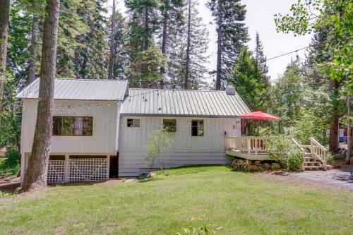 a white house with a porch in a yard at Less Than 2 Blocks to Lake Tahoe Family Home Near Skiing in Homewood