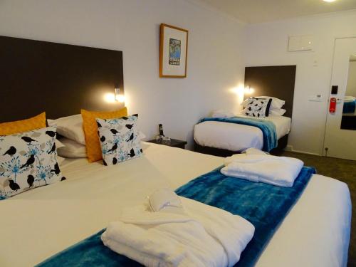 Postel nebo postele na pokoji v ubytování BKs Premier Motel Hamilton