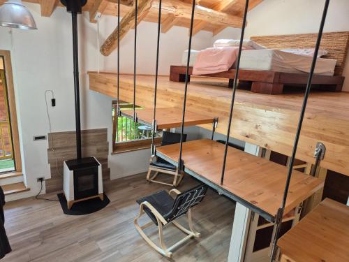 a room with a bunk bed and a desk at Casa S Antonio Aradolo in Borgo San Dalmazzo