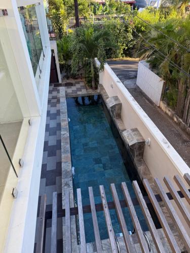 a swimming pool in the middle of a building at Pearl Gate Residence Apt No 3 in Flic-en-Flac