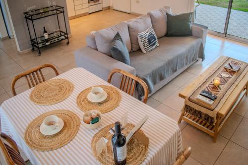 a living room with two tables and a couch at Chito House in Buenos Aires