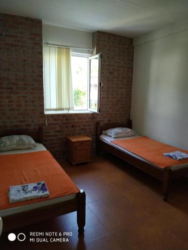 Ein Bett oder Betten in einem Zimmer der Unterkunft Apartments Simovic