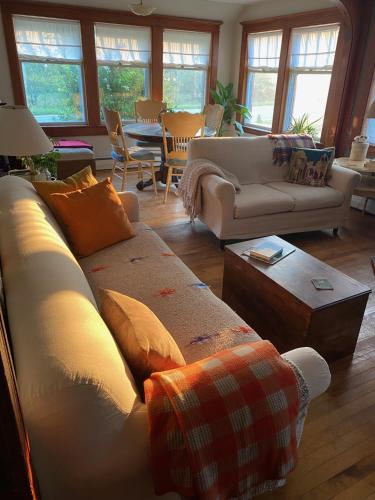 a living room with a couch and a table at Studio 181 Bed & Breakfast in Port Clyde