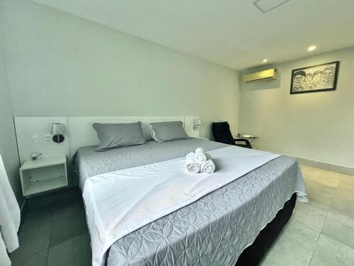 Ένα ή περισσότερα κρεβάτια σε δωμάτιο στο Refúgio aconchegante c/ Piscina no Águas da Serra