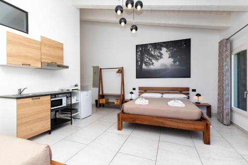 a bedroom with a bed and a desk in it at La Pineta del Borgo in Ravenna