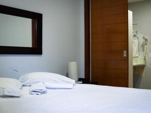 En eller flere senge i et værelse på Elegance flat Natal RN - PLAC