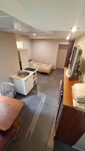 a small room with a sink and a bed in it at Jurmala Beach in Jūrmala