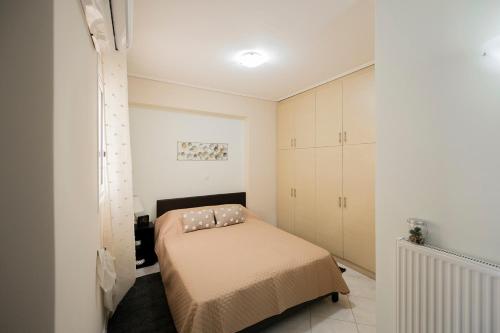 En eller flere senge i et værelse på Sparta View Suite Γ1