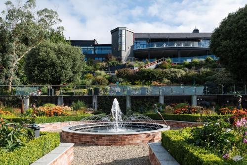 a fountain in a garden in front of a building at The Montenotte Hotel in Cork