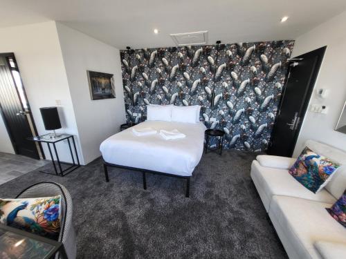 a hotel room with a bed and a couch at 272-274 Accommodation AT in Blackpool