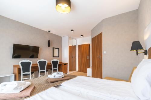 TV a/nebo společenská místnost v ubytování Promocje Amber Park Spa