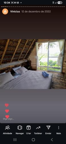 a picture of a room with a bed and a window at Morada da Lua Hospedaria Ecológica in Camaçari