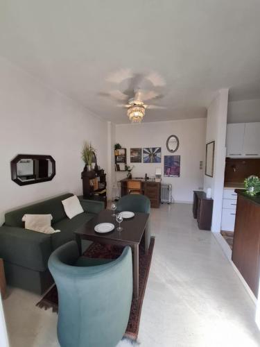 a living room with a couch and a table at Antonys elli beach home in Rhodes Town