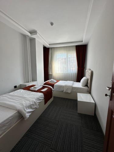 Ένα ή περισσότερα κρεβάτια σε δωμάτιο στο Vira Suite Otel