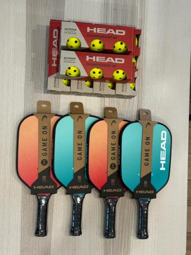 a group of three straps on a wall with a box at Hotel Sport Houštka 