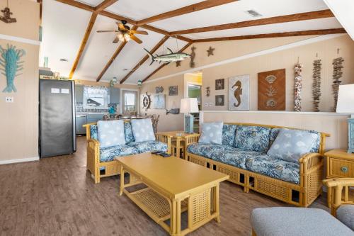 a living room with couches and a table at Afterdune Delight in Salvo