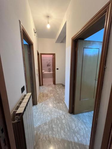 a hallway with a door leading into a room at Casa Vacanza Cupello in Cupello