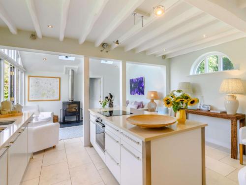 a kitchen with a counter and a living room at 2 Bed in Goudhurst 51229 in Goudhurst