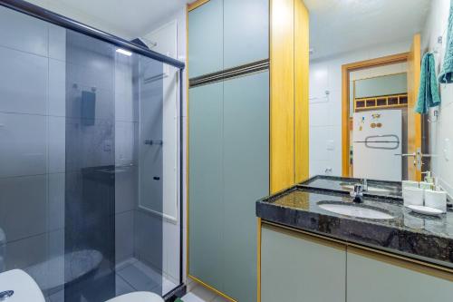 a bathroom with a glass shower and a sink at Malia Beach #D14 - Apartamento por Carpediem in Cupe