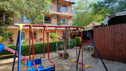 a playground in the backyard of a house at Вила Фернандес in Chernomorets