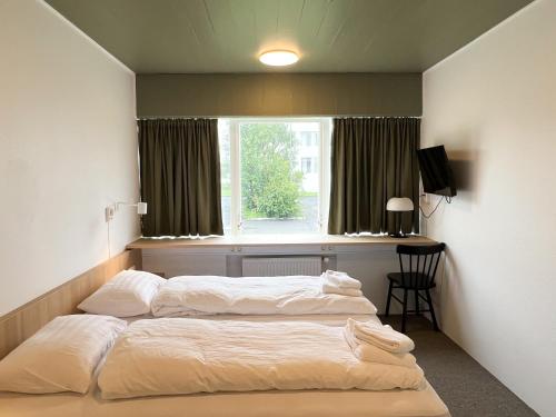 Voodi või voodid majutusasutuse Eiðar - Hostel toas