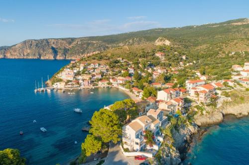 an aerial view of a small town on a hill next to the water at Villa Poseidonia in Katelios
