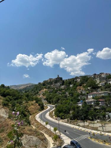 a road on the side of a hill at Albanian Oasis in Gjirokastër