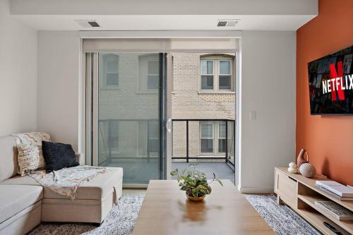 a living room with a couch and a table at W318 Chic & Luxury 1Bd Condo In Downtown Minneapolis, Minutes From Minneapolis Convention Center & US Bank Arena in Minneapolis