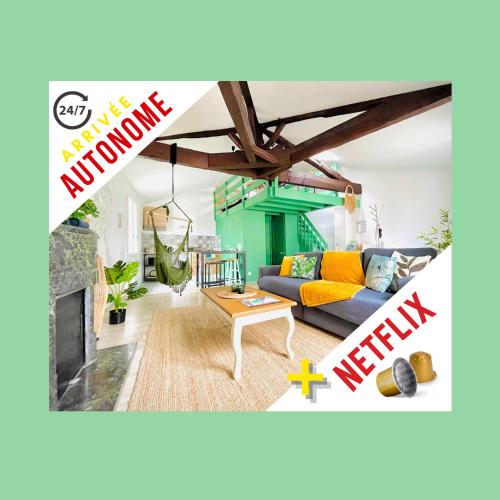 a living room with a couch and a fireplace at Superbe loft insolite au cœur d'Angoulême in Angoulême