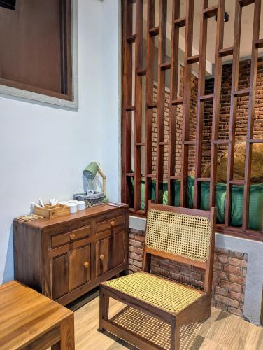 a room with a table and a chair and a desk at Trance rabara resort in Avissawella