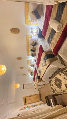 a ceiling of a room with a bunch of pillows at Hôtel Bia Besta in Boumalne