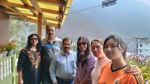 a group of people posing for a picture at Khowti Stay in Dirang Dzong