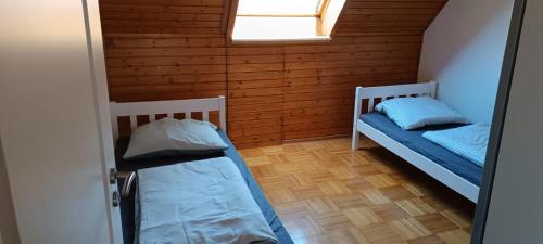 a room with two bunk beds and a window at 2 Zimmer in Geislingen an der Steige