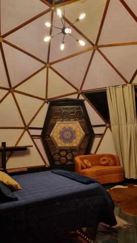 a room with a tent with a bed in it at Chalé Refugio da Pedra SP in São Bento do Sapucaí