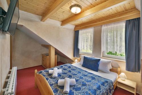Postel nebo postele na pokoji v ubytování Hotel Resort Martin & Kristyna