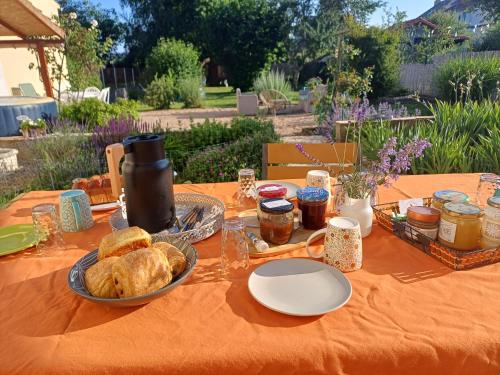 a table with a plate of food and bread on it at L'étoile du matin in Terville