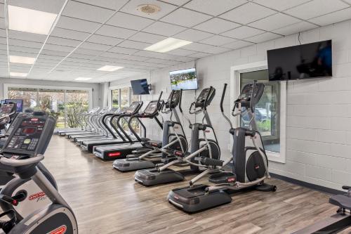 a gym with a row of cardio bikes and treadmills at Beachaholic in Corolla