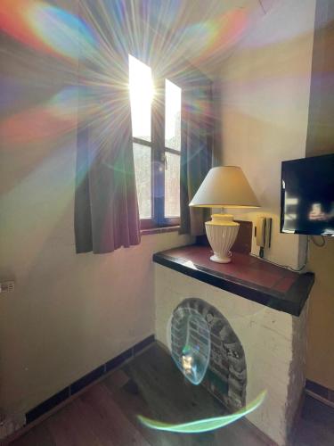 a room with a fireplace with a rainbow at City Flats by Lybeer Hotel Group in Bruges