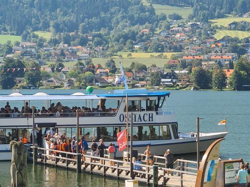 a group of people on a boat on the water at Haus Kleinod in Bodensdorf