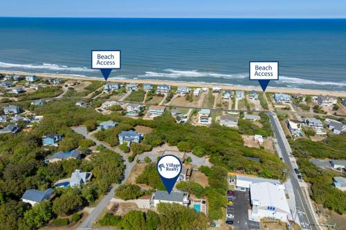 an aerial view of a beach area with houses and the ocean at Aloha Shores in Southern Shores