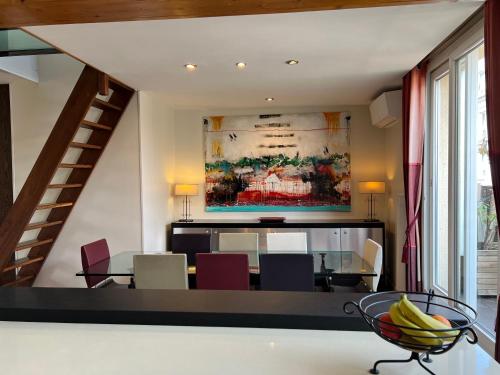 a dining room with a table and chairs at Maison Lavaud in Paris