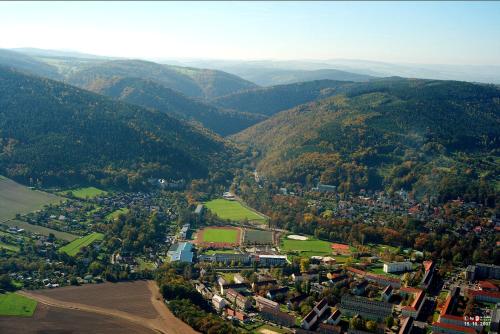 an aerial view of a town in the mountains at Landessportschule Bad Blankenburg in Bad Blankenburg