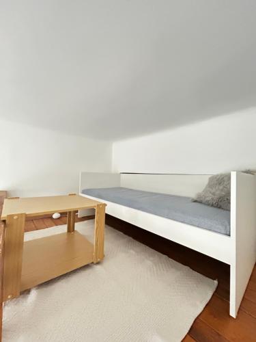 a bedroom with a bed and a table at Central Apartment in Győr