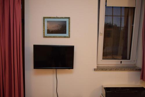 Una televisión o centro de entretenimiento en Casa Galoppa
