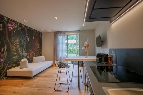 a kitchen with a couch and a table in a room at Villa Amelia in Orta San Giulio