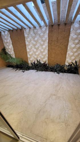 a room with a stone wall and a floor at Comfortable New Family House in Manta