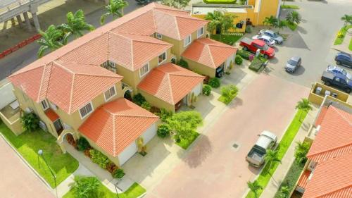 an overhead view of a house with orange roofs at Comfortable New Family House in Manta