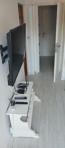 a computer monitor sitting on top of a white desk at Apartman Vesna in Igalo